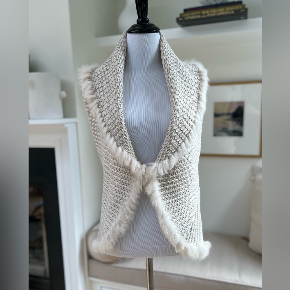 Chic Crocheted vest with fur trim.